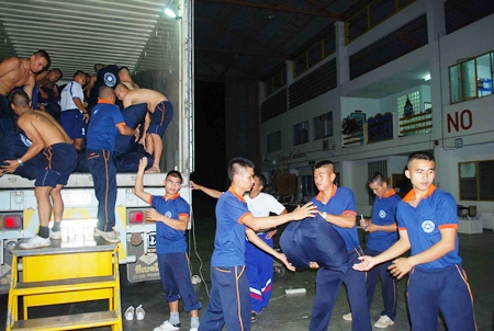 Many hands make light work - sailors from the Royal Thai Navy base in Sattahip load up supplies headed for flood stricken communities in Pichit.